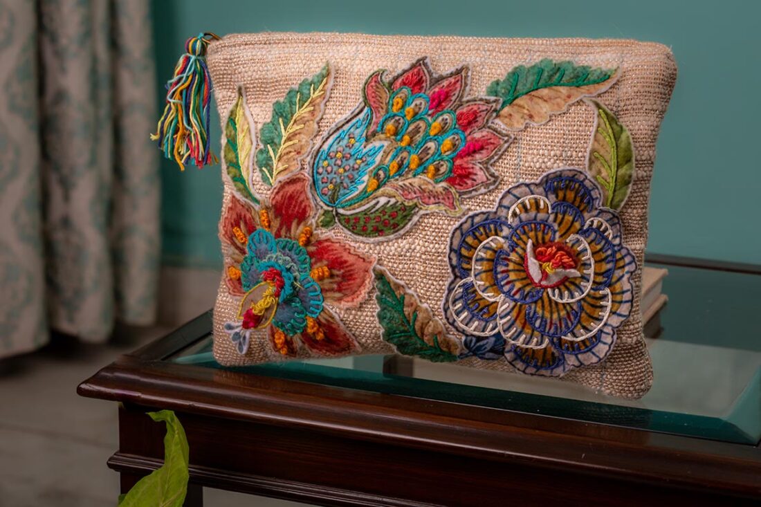 travel floral bag with hand loomed textured gold lure fabric